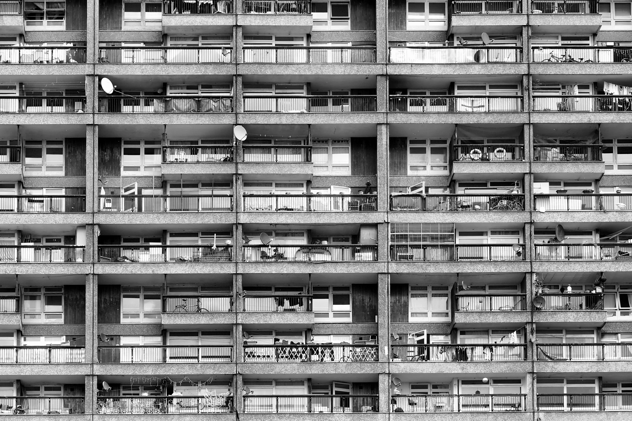 Repeating concrete balconies forming a precise urban facade