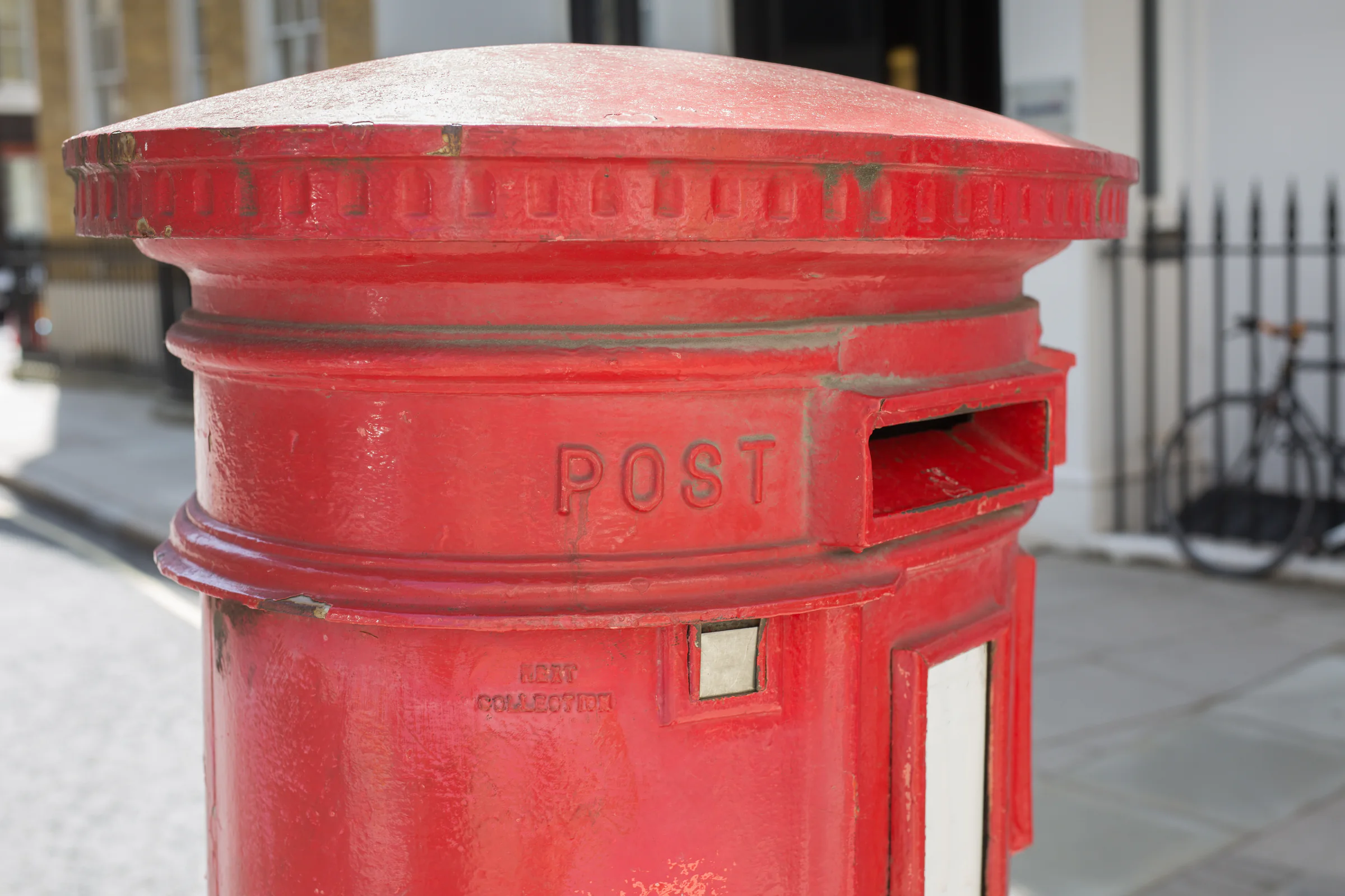 Red British postbox on a London street