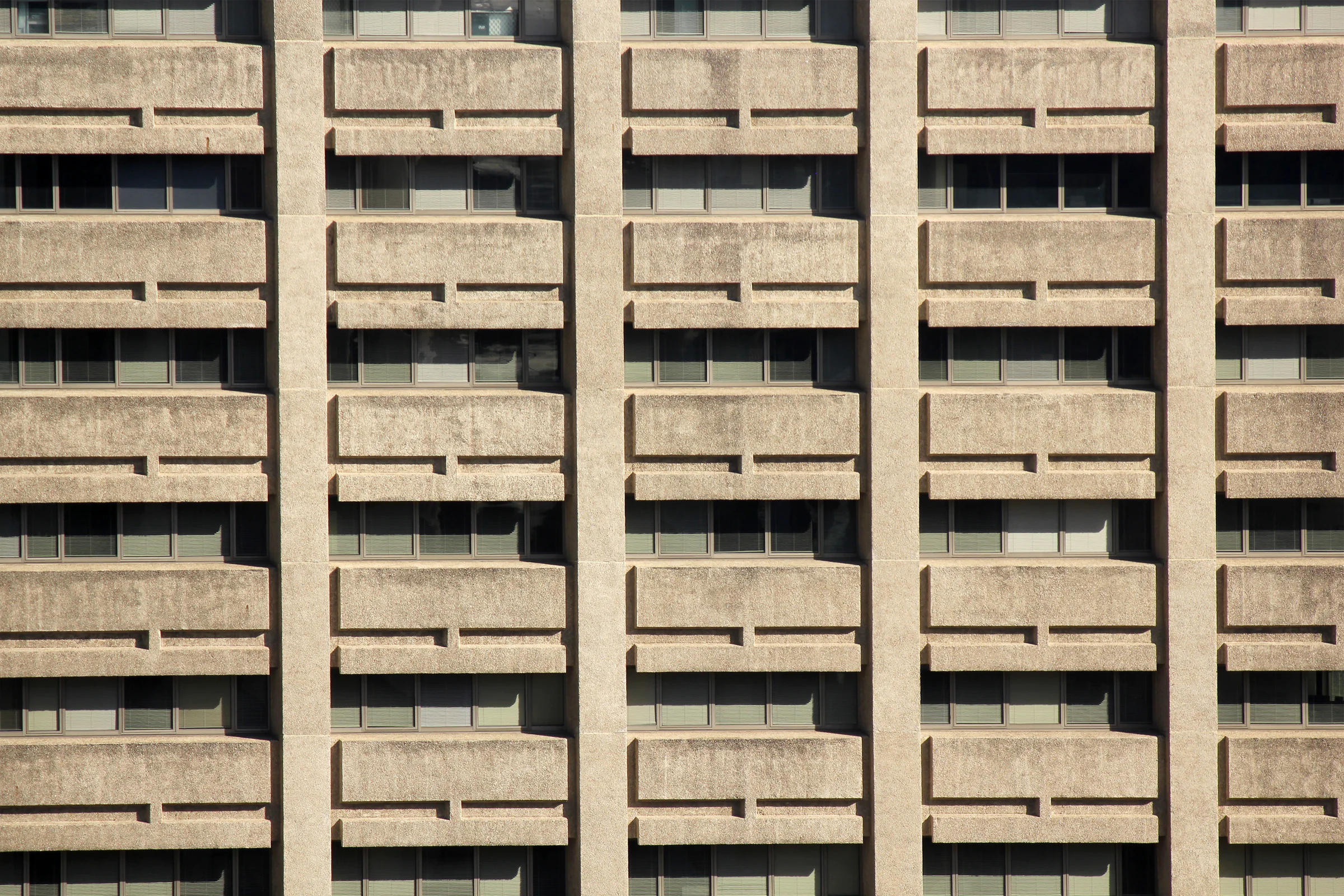 Repeating concrete geometry across a modern urban building